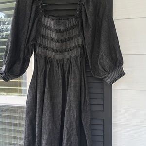 Black denim smocked dress, off shoulder, knee length.